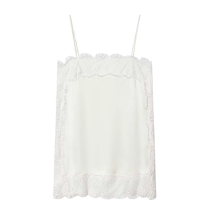 Detail of delicate white lace trim on a luxurious satin camisole top with thin straps