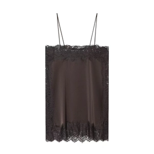 Detail of black silk satin camisole showing intricate floral lace trim and spaghetti straps
