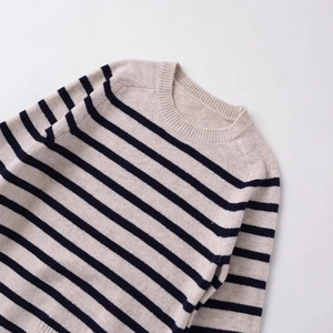 Classic striped crewneck knit sweater in beige and navy blue with a minimalist design