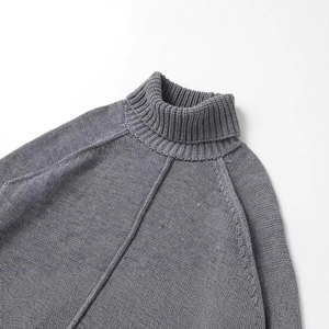 Grey high-neck chunky knit sweater featuring ribbed collar and raglan sleeve details