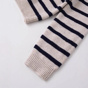 Chic striped knit sweater in oatmeal and navy blue with ribbed cuff details