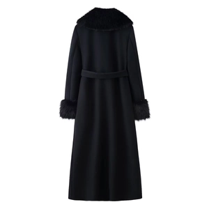 Women's black long wool coat featuring a large faux fur collar and belted waist from back view