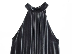 Close-up of dark grey velvet halter top fabric with pleats and rich soft texture