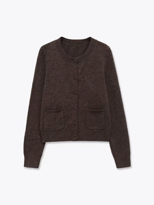 Close-up of dark brown knit cardigan featuring round neck and two front pockets