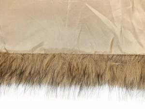 Detail of khaki jacket with brown faux fur lining and high-quality textured fabric
