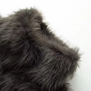 Elegant dark grey faux fur coat with a fluffy texture and soft plush finish for women