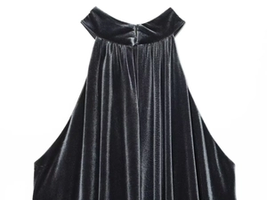 Detailed view of dark grey velvet halter top with pleated neckline and rich texture