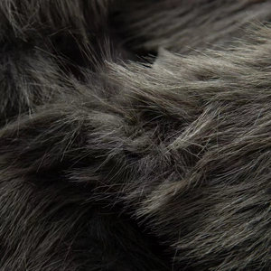 Macro shot of dense faux fur material in charcoal and taupe shades for luxury coats