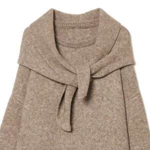 Women's tan knit sweater with matching scarf neck detail and elegant crew neck design