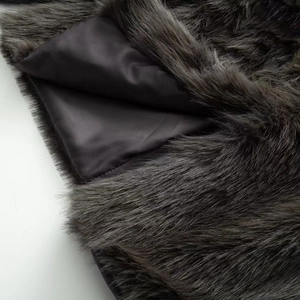 Elegant dark grey faux fur coat for women with fluffy texture and smooth silk lining