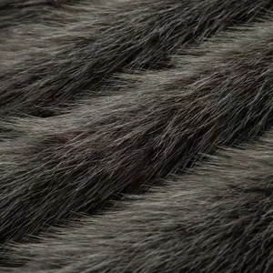 Close-up of deep grey faux fur texture showing soft fibers and natural luster detail