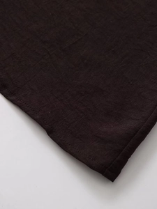 Detailed close-up of dark brown cotton-linen fabric with professional fine stitching