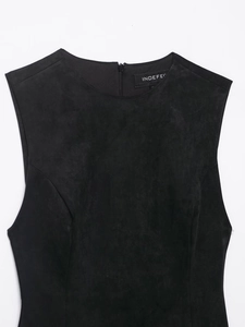 Detail of black faux suede dress with round neck and exposed back zipper closure