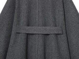 Detail view of the deep gray wool coat back with structured decorative waist strap