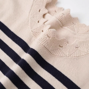 Women's chic black and white striped knit top featuring hollow-out crochet detail