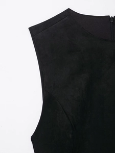 Close-up of black suede dress showing the high-quality invisible zipper and matte texture