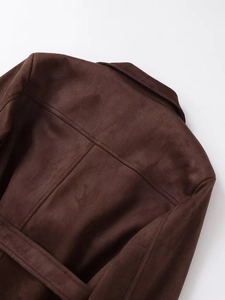 Detail view of the back seams and suede texture on this dark brown jacket