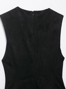 Close-up of black suede texture dress featuring a hidden zipper back closure detail