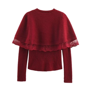 Detailed view of burgundy knit cardigan featuring intricate lace trim on the shoulder cape