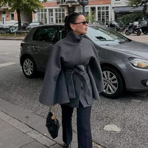 Elegant grey wool blend poncho coat with high collar and belted waist for women's autumn style