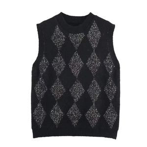 Women's black knit sweater vest with silver sequin argyle pattern and ribbed edges