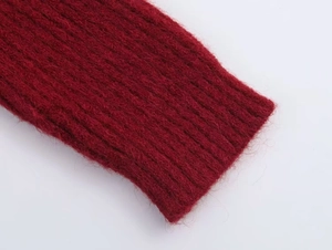 Detailed macro view of the deep red ribbed knit cuff with soft mohair texture