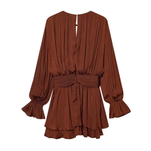 Detailed view of caramel brown pleated mini dress with smocked waist and ruffled hem