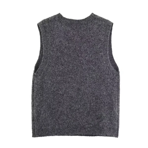 Close-up of high-quality fuzzy knit texture and ribbed neckline on dark grey sweater vest