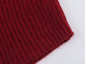 Detail view of the burgundy ribbed knit texture and soft fuzzy mohair fabric finish