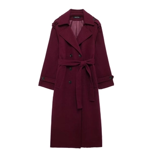 Detailed flat lay of a burgundy double-breasted wool coat with waist belt and lapel