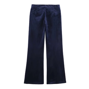 Detail of high-waisted dark blue velvet wide-leg trousers with elegant flowing texture