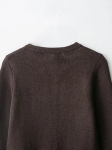 Close-up of the reinforced round neckline on this dark brown long-sleeve knit cardigan