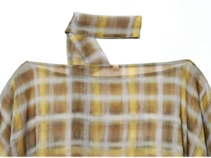 Detail of boat neckline and matching scarf on a yellow plaid chiffon blouse for women