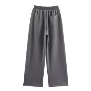 Detail view of dark grey wide leg rib trousers with elastic waist and back square pocket