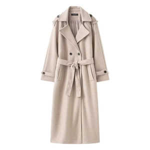 Detail view of double-breasted beige wool coat featuring waist belt and epaulette details