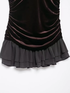 Detail of velvet bodice with pleats and layered chiffon ruffles on autumn dress