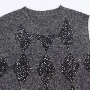 Dark gray fuzzy mohair sweater with black sequin diamond patterns and cozy texture