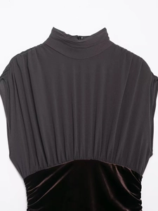 Detail of high collar pleated mesh top with burgundy velvet waist and back zipper