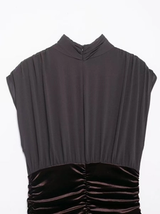 Detail of high neck sleeveless dress with grey pleated mesh and brown velvet panels