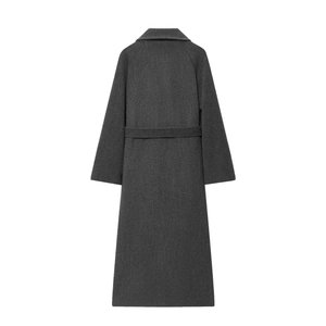 Rear view of dark gray long wool coat featuring a sharp cut and matching waist belt
