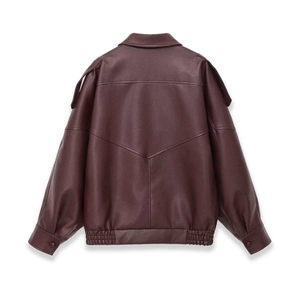 Detail view of burgundy faux leather jacket back with shoulder tabs and elastic waist