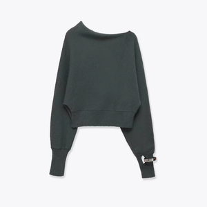 Dark grey off-shoulder knit sweater with loose silhouette and silver ring on the cuff
