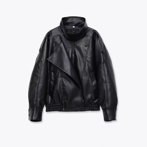 Detailed view of the black faux leather jacket featuring a textured lychee grain finish