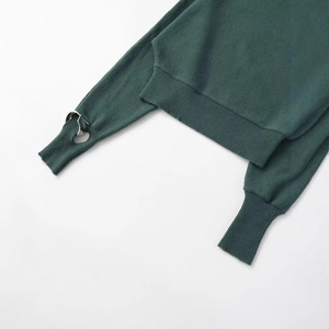 Deep green oversized off-shoulder knit top with silver ring detail and ribbed cuffs