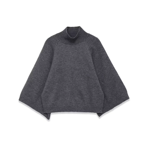 Detail shot of loose-fit dark grey turtleneck sweater with batwing sleeves and ribbing