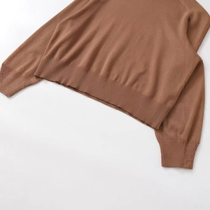 Brown knit sweater with ribbed hem and cuffs shown in a high quality flat lay view