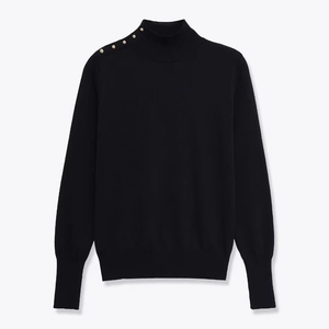 Women's slim black turtleneck knit sweater with gold rivet buttons on the shoulder
