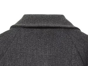 Detail of dark grey wool blend fabric texture and collar stitching on long coat