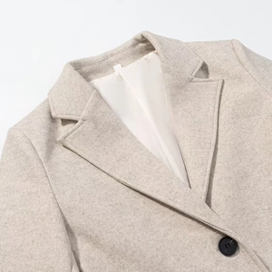 Women's minimalist oatmeal wool coat with notched lapels and shoulder pads
