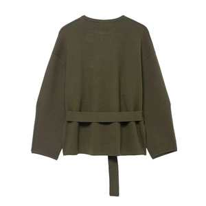 Olive green knit sweater with round neck and back waist belt detail on white background